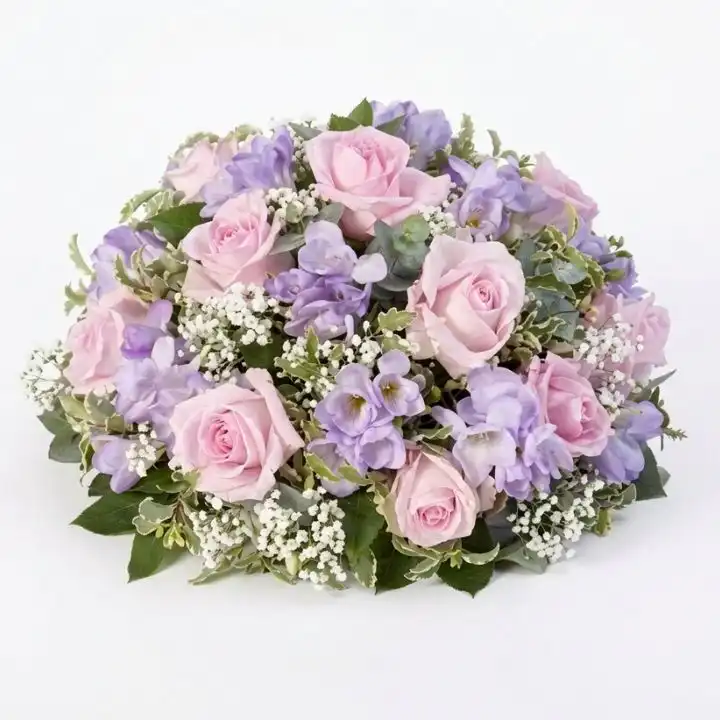 Blush Pink Dried Floral Wreath 1 A handcrafted blush pink dried floral wreath featuring preserved roses and botanicals, perfect for rustic wall decoration.