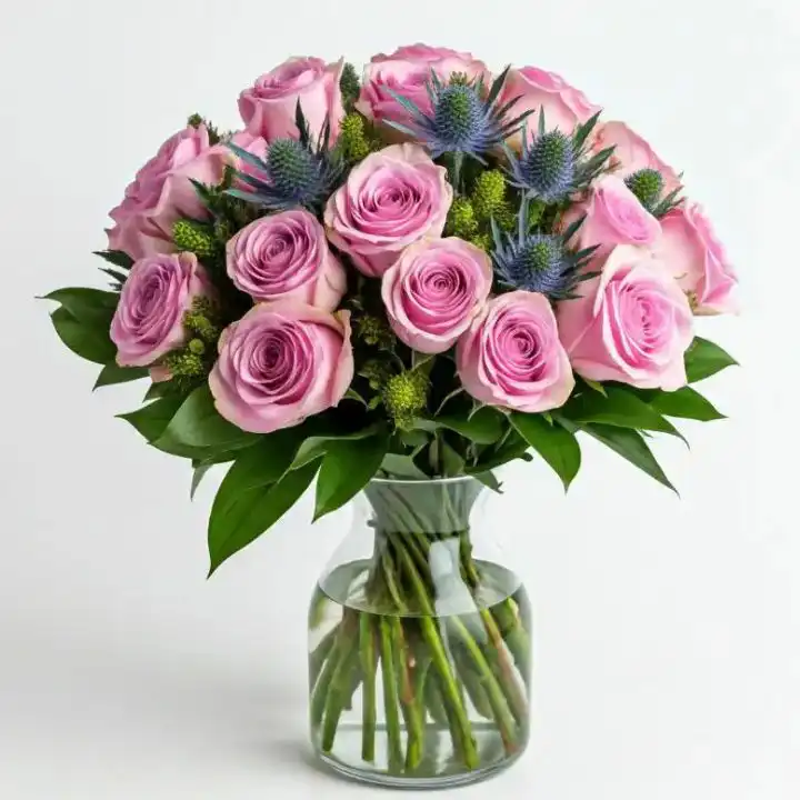 Elegant Pink Rose & Thistle Bouquet 1 A beautiful pink rose and thistle bouquet arranged with fresh greenery in a classic style.