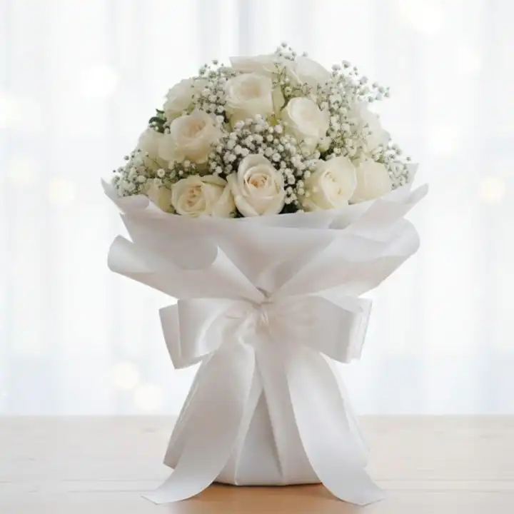 Bridal Rose & Baby's Breath Bouquet 1 A stunning bridal white rose bouquet accented with delicate baby's breath flowers for a classic wedding look.