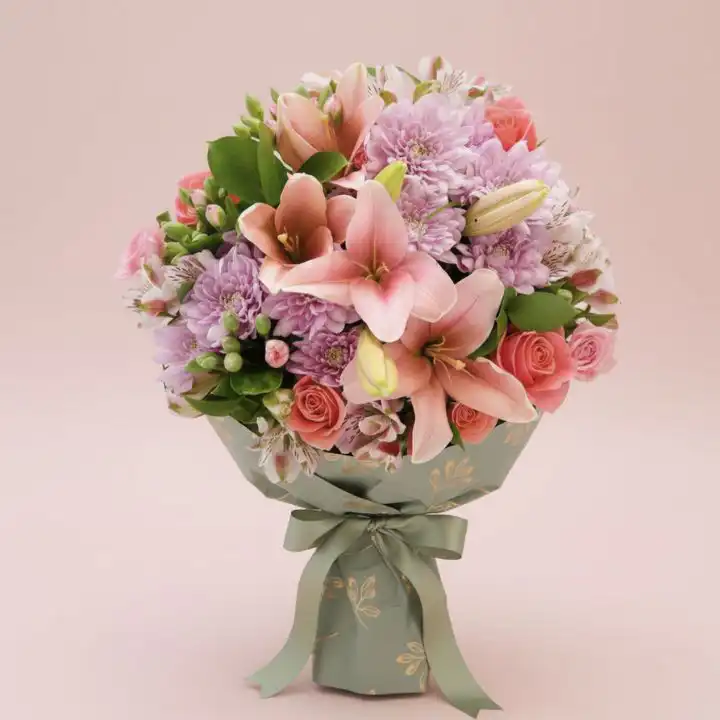 The Romantic Pink Lily & Chrysanthemum Bouquet 1 A hand-tied chrysanthemum and lily bouquet featuring vibrant pink petals and fresh white blossoms in a decorative wrap.