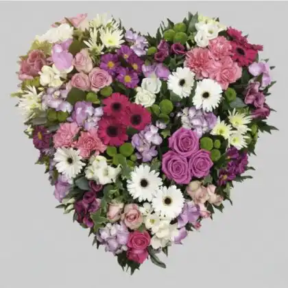 Wishlist 9 A professional floral arrangement designed as a broken heart funeral tribute featuring white and red flowers.