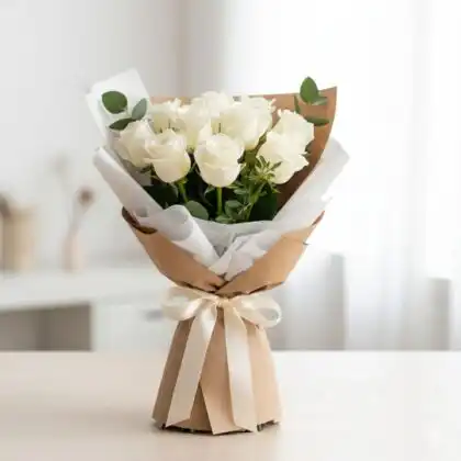 A beautifully arranged 12 roses bouquet featuring deep red petals and lush greenery for a classic romantic gesture.