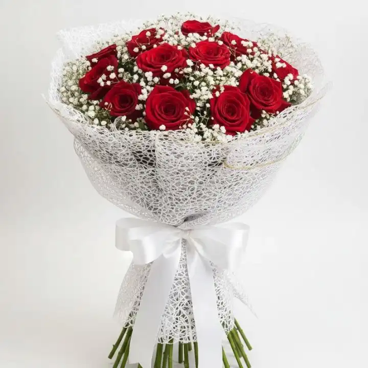 Crimson Elegance 16 Rose Bouquet 1 A vibrant 16 rose bouquet featuring deep red petals nestled in white baby's breath and elegant lace wrapping.