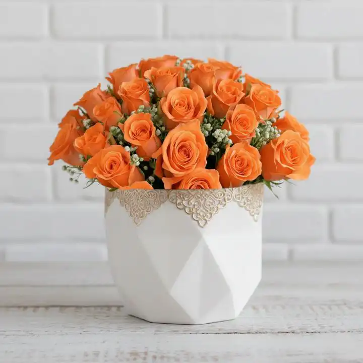 Orange Bliss - Rose Bouquet with Baby’s Breath 1 A vibrant Orange Rose Bouquet accented with white baby’s breath and green leaves against a clean white background.