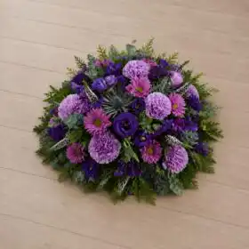 Vibrant Purple Carnation and Lisianthus Funeral Posy with Blue Thistle